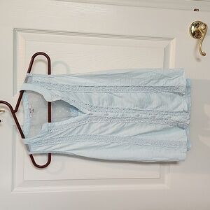 Pale blue sleeveless summer top with lace inset and dotted Swiss accent on back